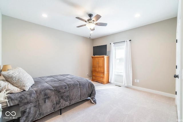 carpeted bedroom with ceiling fan