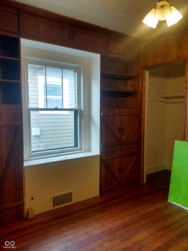 bedroom with hardwood / wood-style flooring