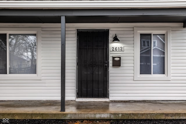 doorway to property featuring a porch