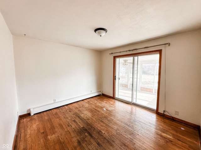 empty room with a baseboard radiator and wood-type flooring