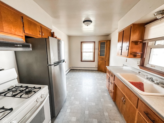 kitchen with a baseboard heating unit, sink, and white range with gas stovetop