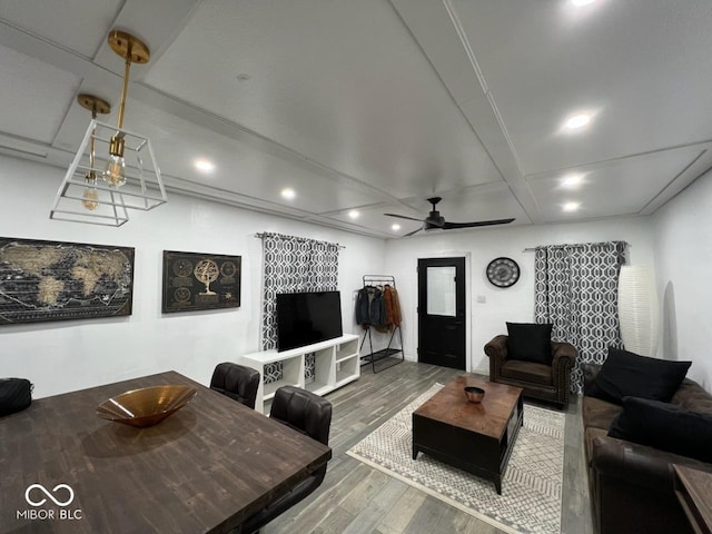 living room featuring beam ceiling, a ceiling fan, wood finished floors, and recessed lighting