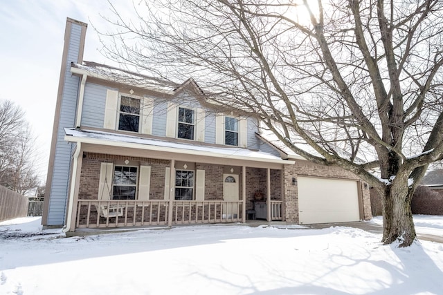 view of front of house featuring an attached garage, a chimney, a porch, and brick siding