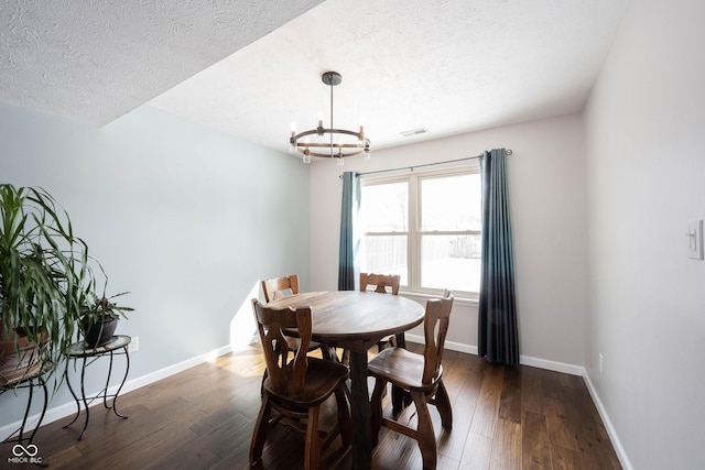 dining area featuring baseboards, visible vents, and dark wood-type flooring