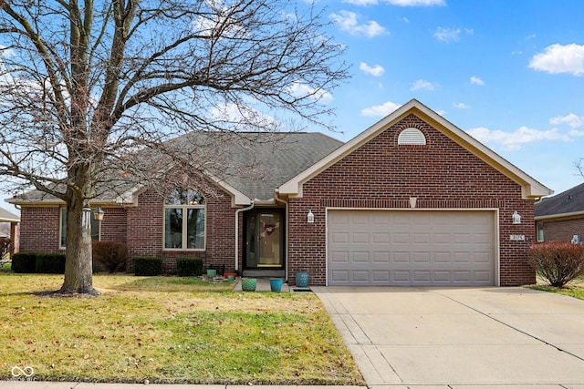 view of front of house featuring a garage and a front yard