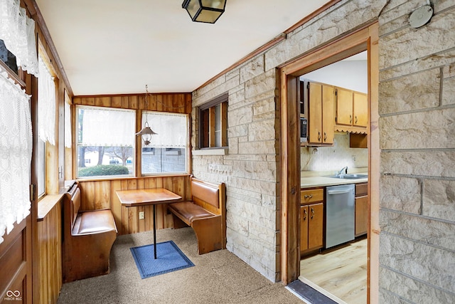 sunroom / solarium featuring lofted ceiling and breakfast area