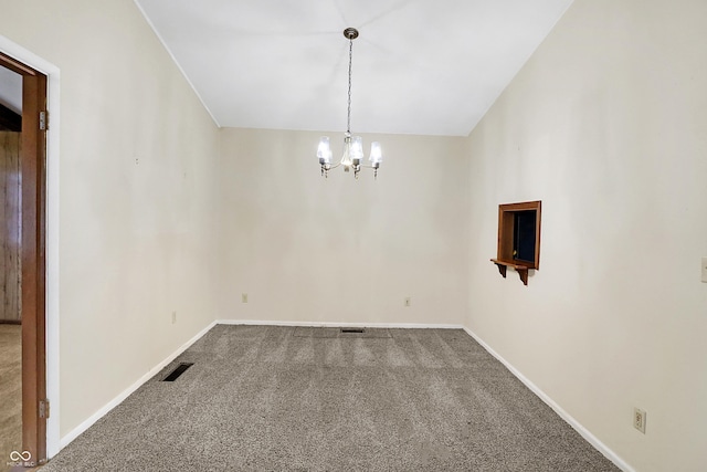 unfurnished dining area with carpet and a notable chandelier