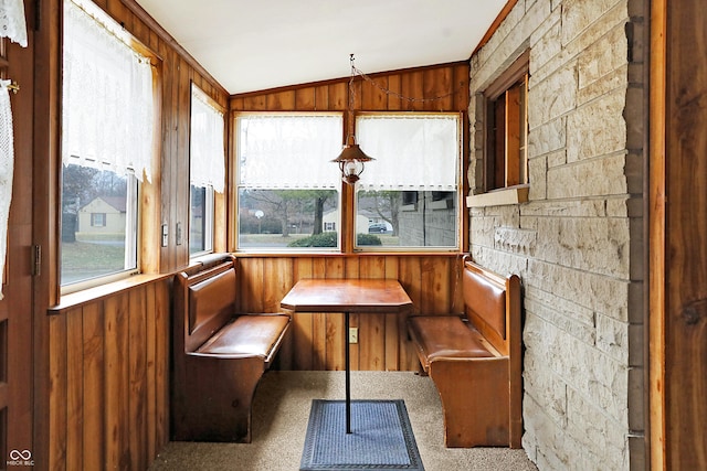 unfurnished sunroom with breakfast area and vaulted ceiling