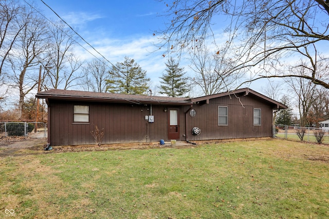 rear view of house with a lawn