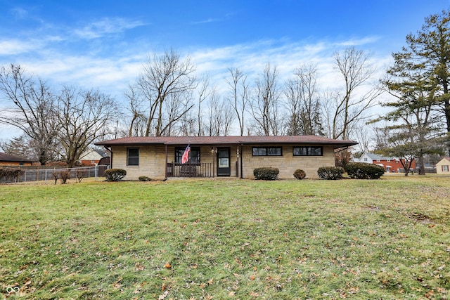 ranch-style home with a front lawn