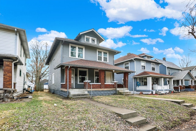 view of front facade featuring a front yard and a porch