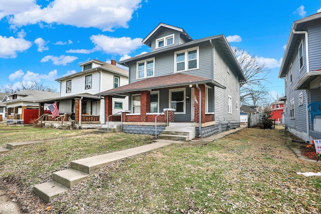 view of front facade featuring covered porch and a front lawn