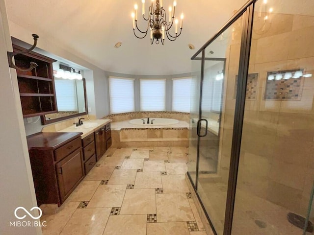 bathroom with a notable chandelier, shower with separate bathtub, and vanity