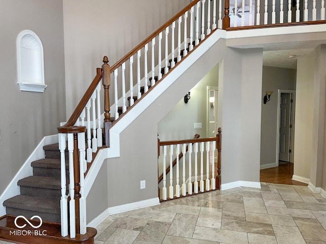 stairway with a towering ceiling