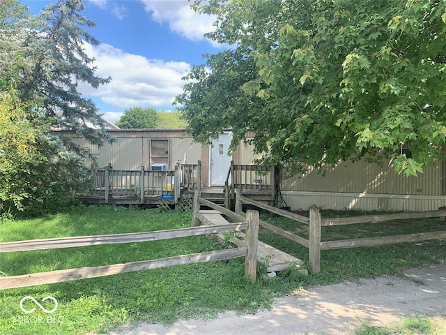 manufactured / mobile home with a wooden deck