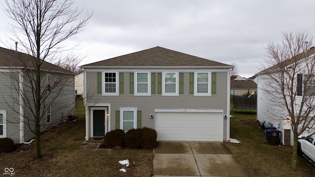 view of front of house featuring a trampoline and a garage