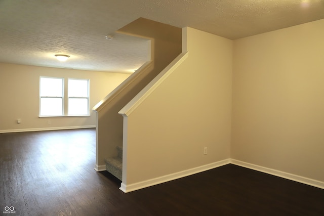 interior space with hardwood / wood-style floors and a textured ceiling