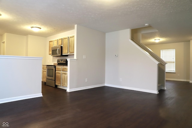 unfurnished living room with dark hardwood / wood-style floors and a textured ceiling