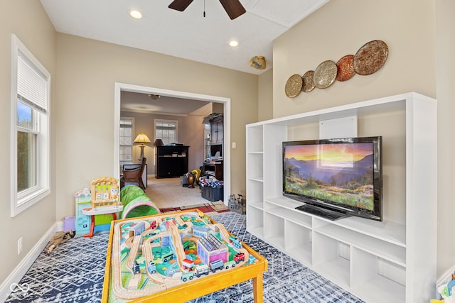 playroom featuring carpet floors and ceiling fan