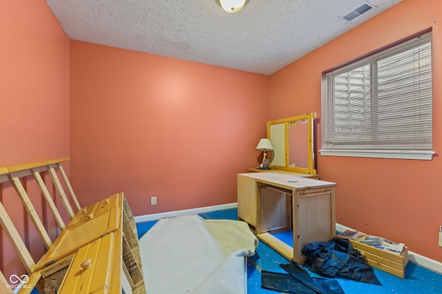 bedroom with a textured ceiling