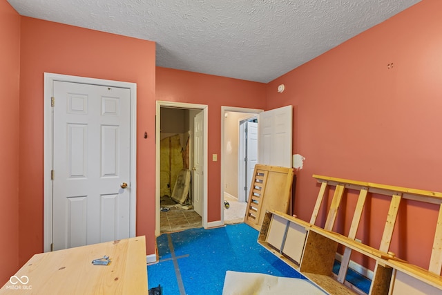 interior space featuring a textured ceiling