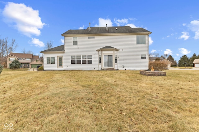 rear view of house with a lawn