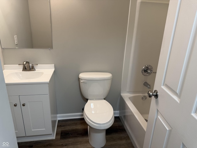 bathroom featuring wood-type flooring, vanity, and toilet