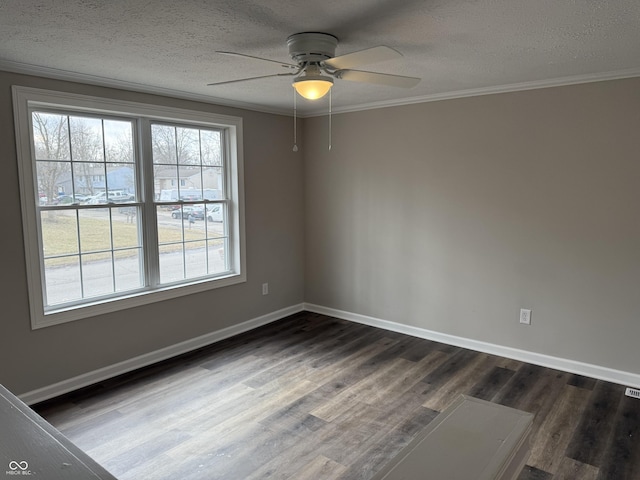 unfurnished room with crown molding, ceiling fan, dark hardwood / wood-style flooring, and a textured ceiling