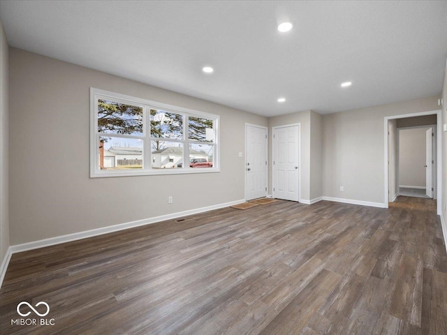 interior space with dark hardwood / wood-style floors