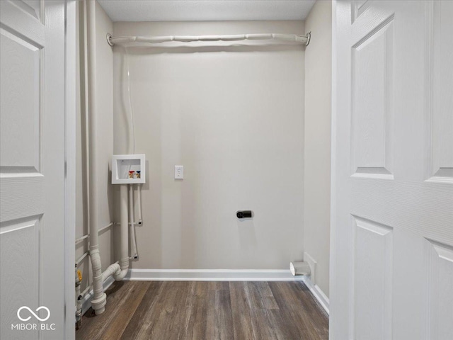 laundry area with hookup for a washing machine, electric dryer hookup, and dark hardwood / wood-style floors