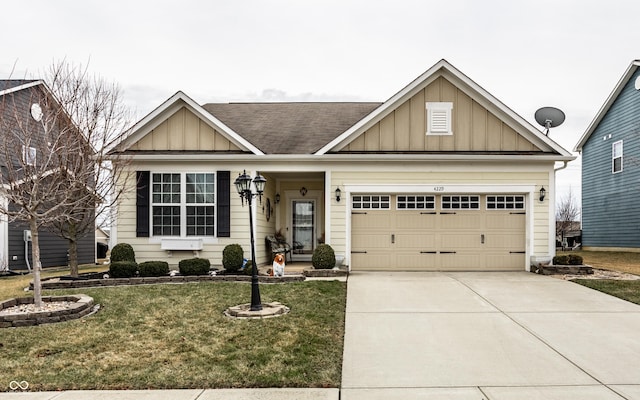 view of front of home with a garage and a front lawn