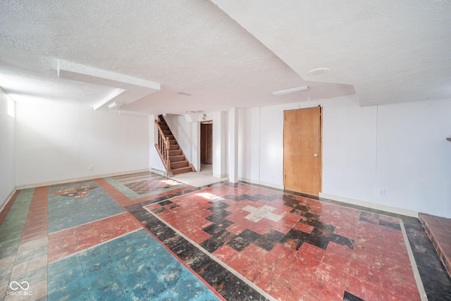 basement featuring a textured ceiling