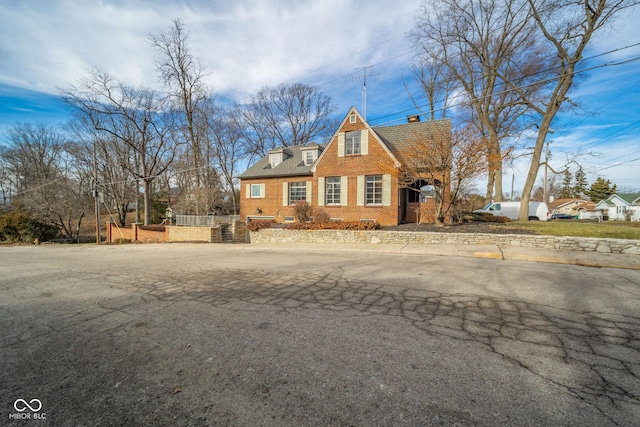 view of new england style home