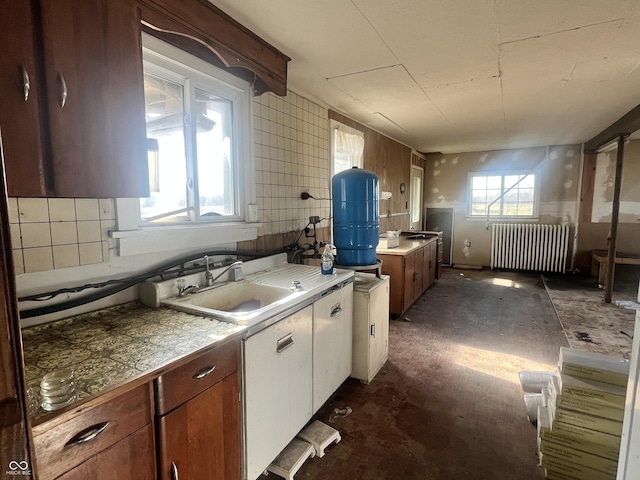 kitchen with sink and radiator heating unit