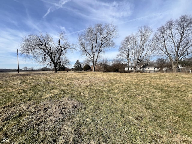 view of yard with a rural view