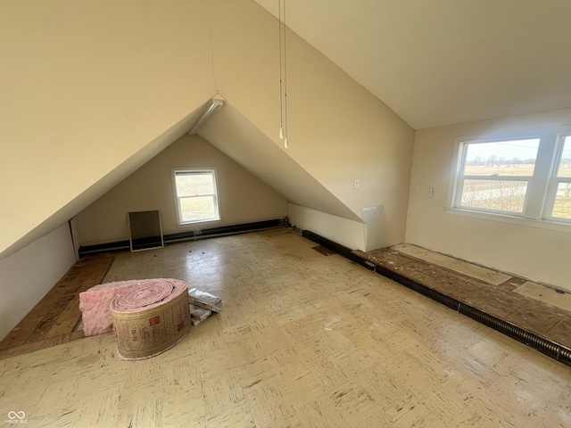 additional living space featuring vaulted ceiling