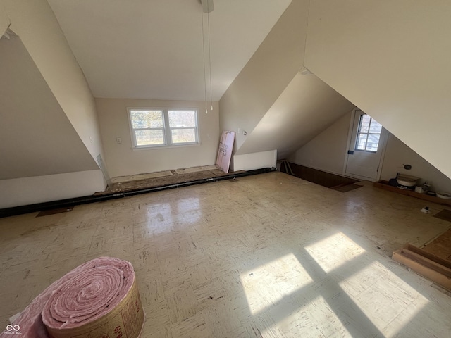 bonus room featuring vaulted ceiling and a healthy amount of sunlight