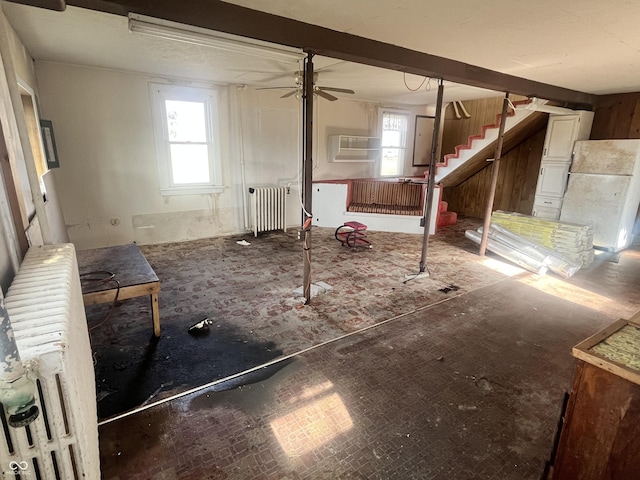 interior space with a wealth of natural light and radiator heating unit