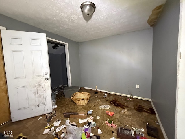 unfurnished bedroom with a textured ceiling