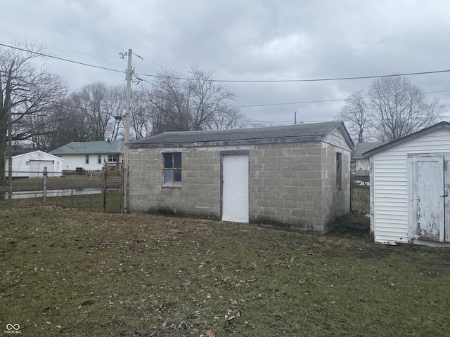 view of outbuilding with a yard