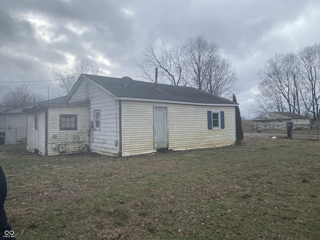 view of outbuilding with a lawn