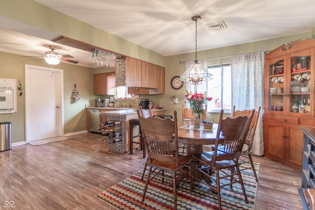 dining room featuring ceiling fan and light wood-type flooring