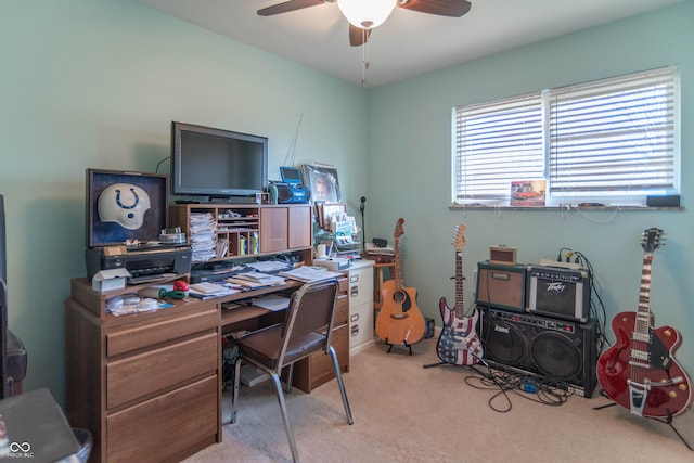 office space featuring light carpet and ceiling fan