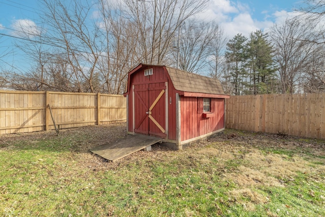 view of outbuilding featuring a lawn