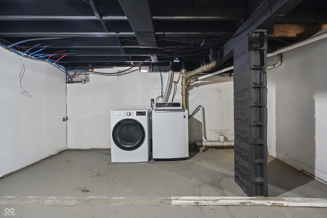 basement featuring washing machine and clothes dryer