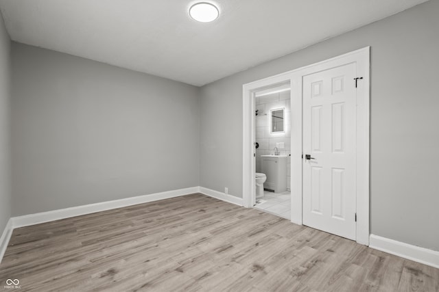 empty room with light hardwood / wood-style floors