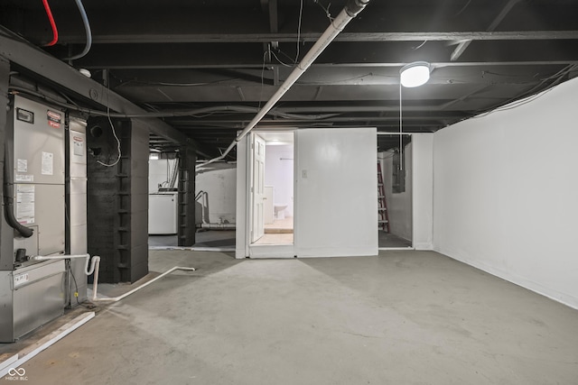 basement featuring washer / dryer and electric panel