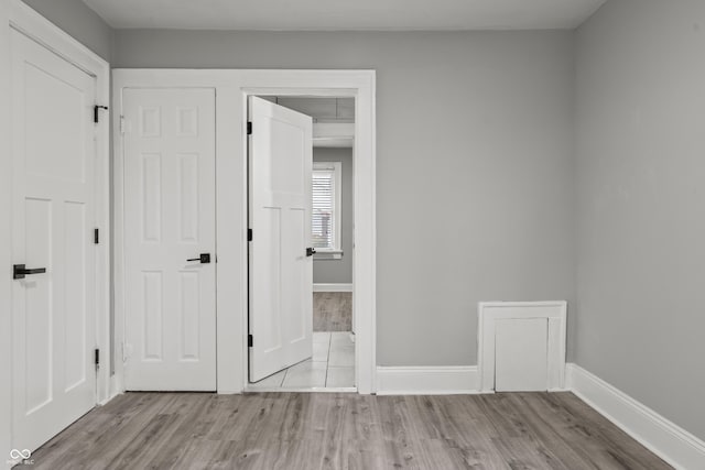 unfurnished bedroom featuring light wood-type flooring