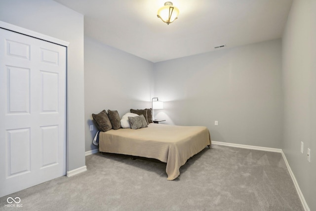 bedroom with light carpet