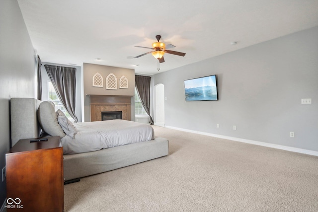 carpeted living room with ceiling fan